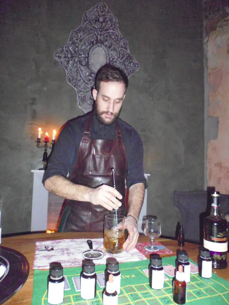 Bartender Nikos at The Clumsies attending to our cocktail needs in "The Room"