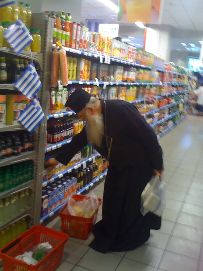 Priest going about his every day - well, he has to eat.