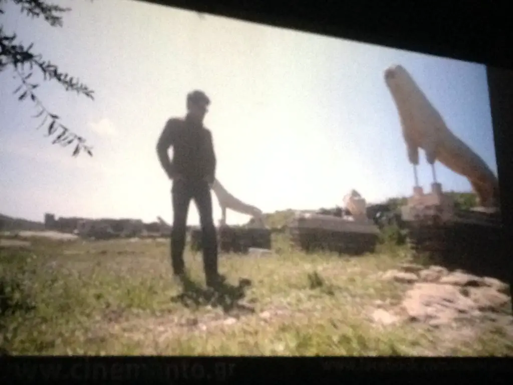 Georgos Chorraface in silhouette against the Avenue of the Lions in the Documentary