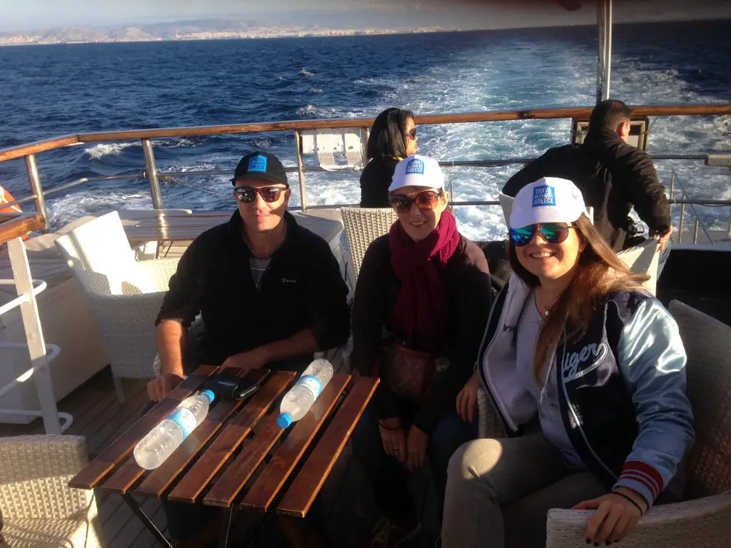 Travel Bloggers Greece relaxing on the top deck of Olympic Cruises