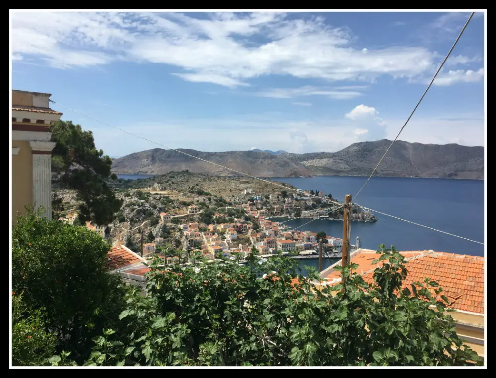 View of Symi island Harbour, Greece from the Hora. Life Beyond Borders